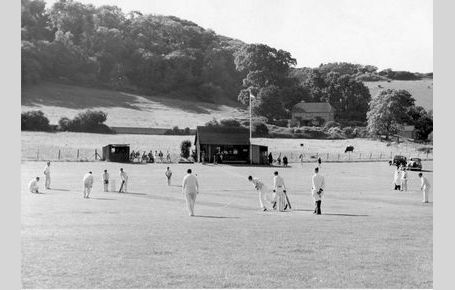 Cricket with old pavilion